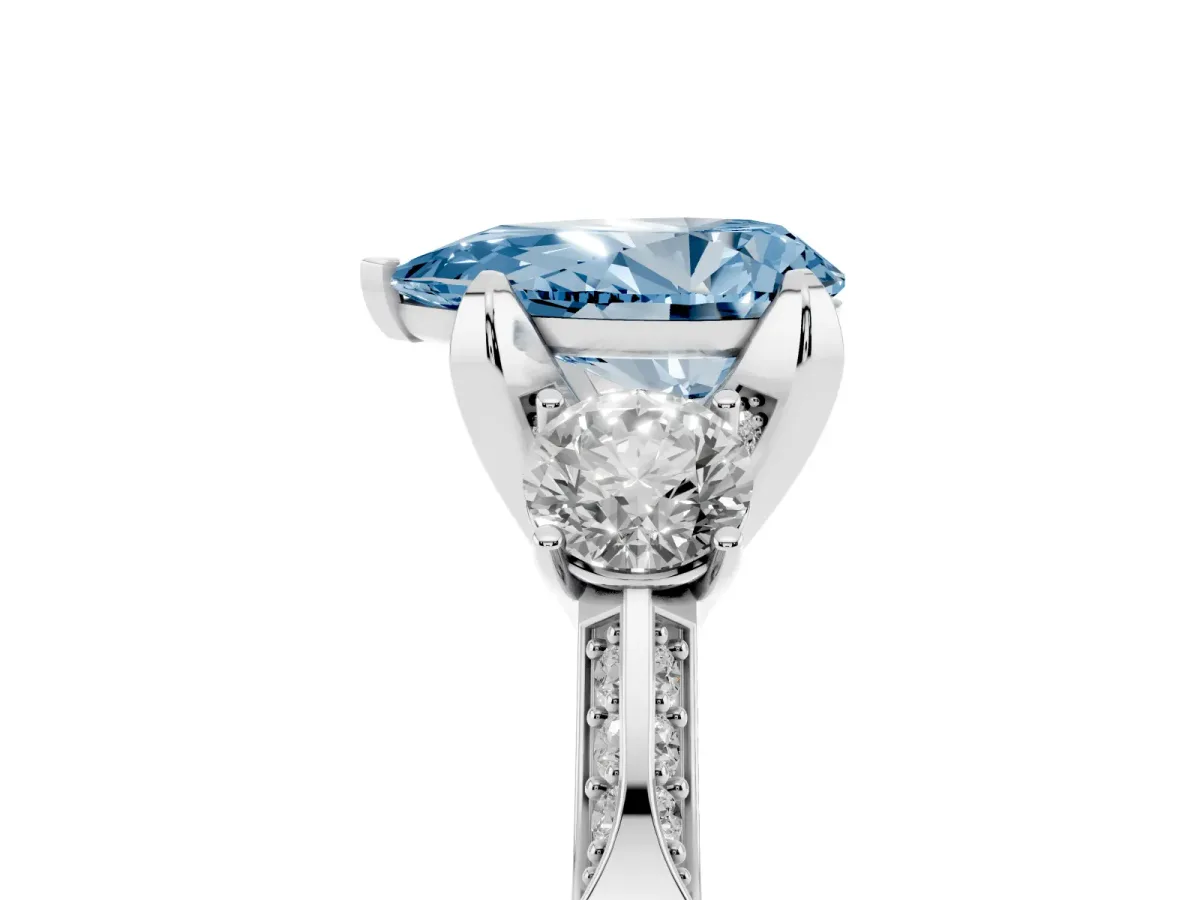 Fancy Blue Pear Cut Brilliant Three-Stone Diamond Ring with Pavé Band and Four-Prong Setting Silver