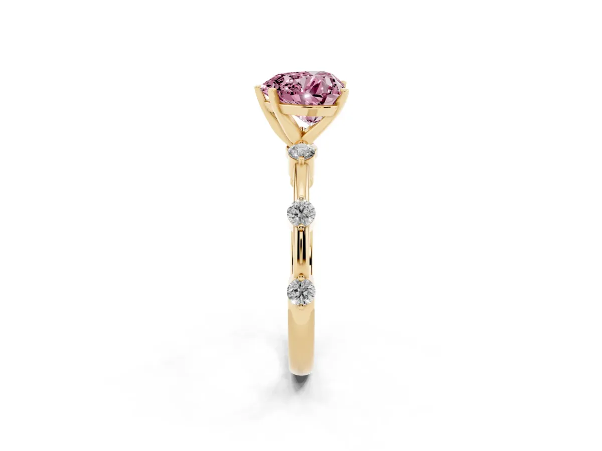 Fancy Pink Heart Cut Solitaire Diamond Ring with Bezel Set Side Stones and Prong Setting Yellow gold