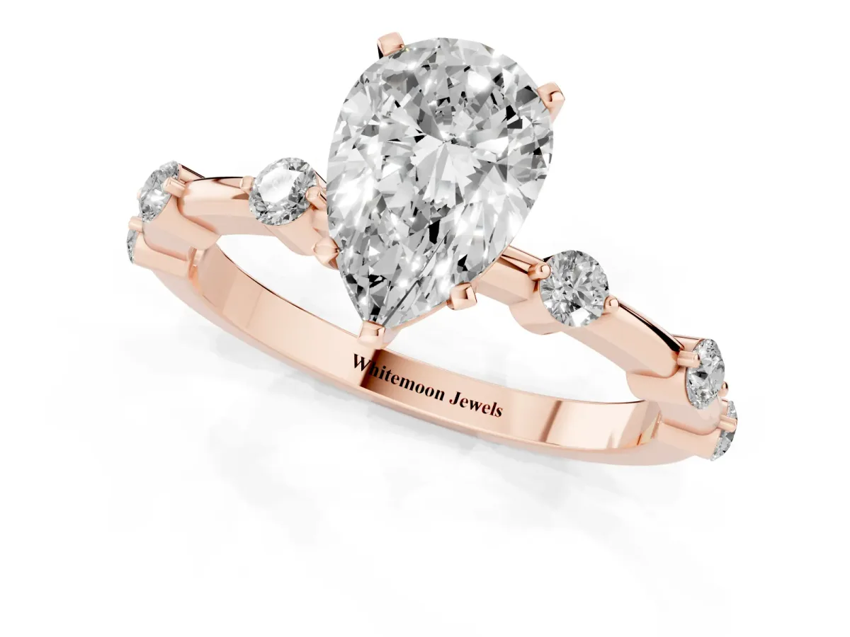 Pear Cut Solitaire Diamond Ring with Bezel Set Side Stones and Prong Setting Rose gold