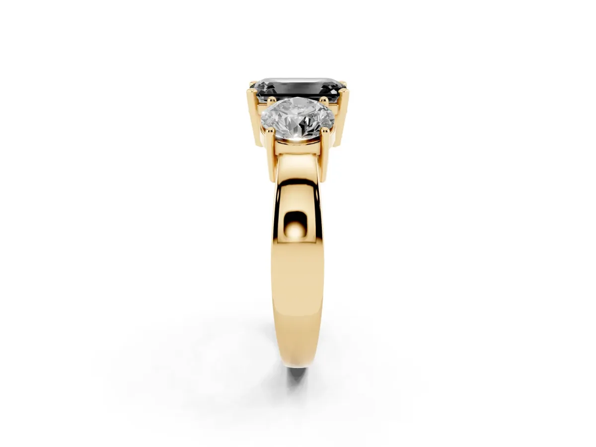 Fancy Black Three-Stone Emerald Cut Diamond Ring with Round Side Stones, Classic Band, and Four-Prong Setting Yellow gold
