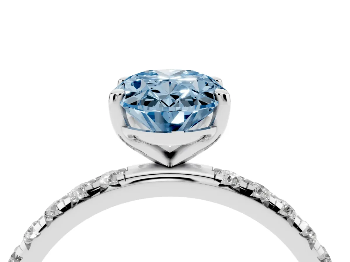 Fancy Blue Oval Cut Cut Diamond Solitaire Ring with Micro Pave Band and Four Prong Setting Silver