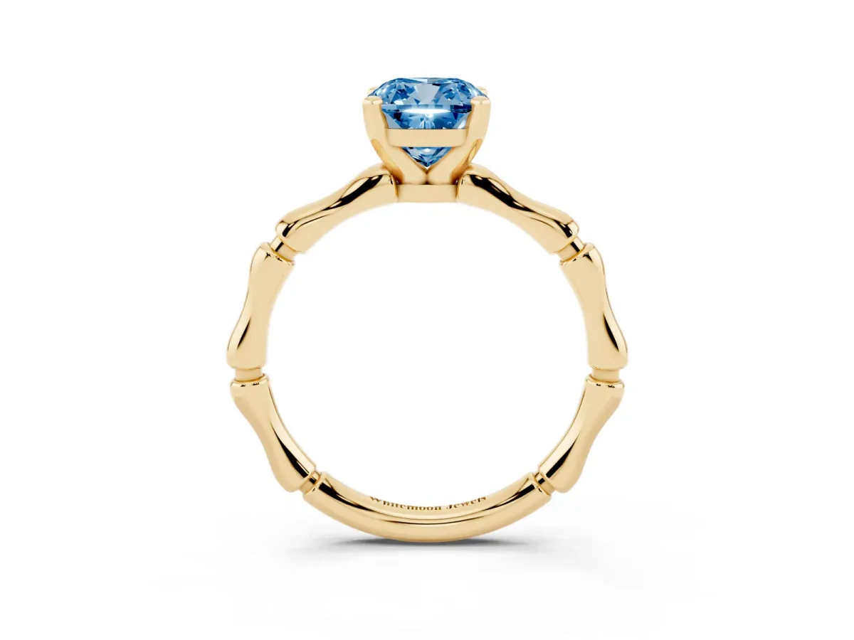 Fancy Blue Cushion Cut Solitaire Diamond Ring with Bamboo Band and Four-Prong Setting Yellow gold