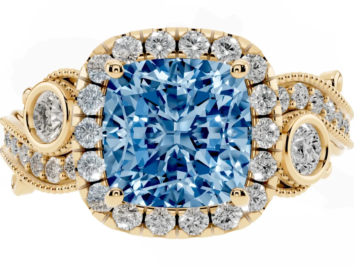 Fancy Blue Cushion Cut Halo Diamond Ring with Milgrain and Bezel Accents on a Split Shank Band Yellow gold