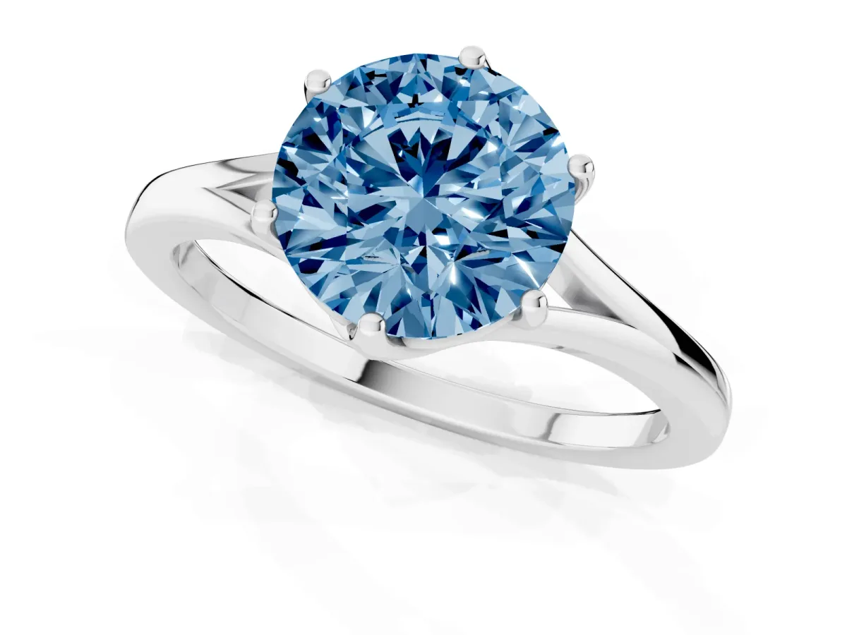 Fancy Blue Round Cut Solitaire Diamond Ring with Six-Prong Setting and Tapered Band Silver