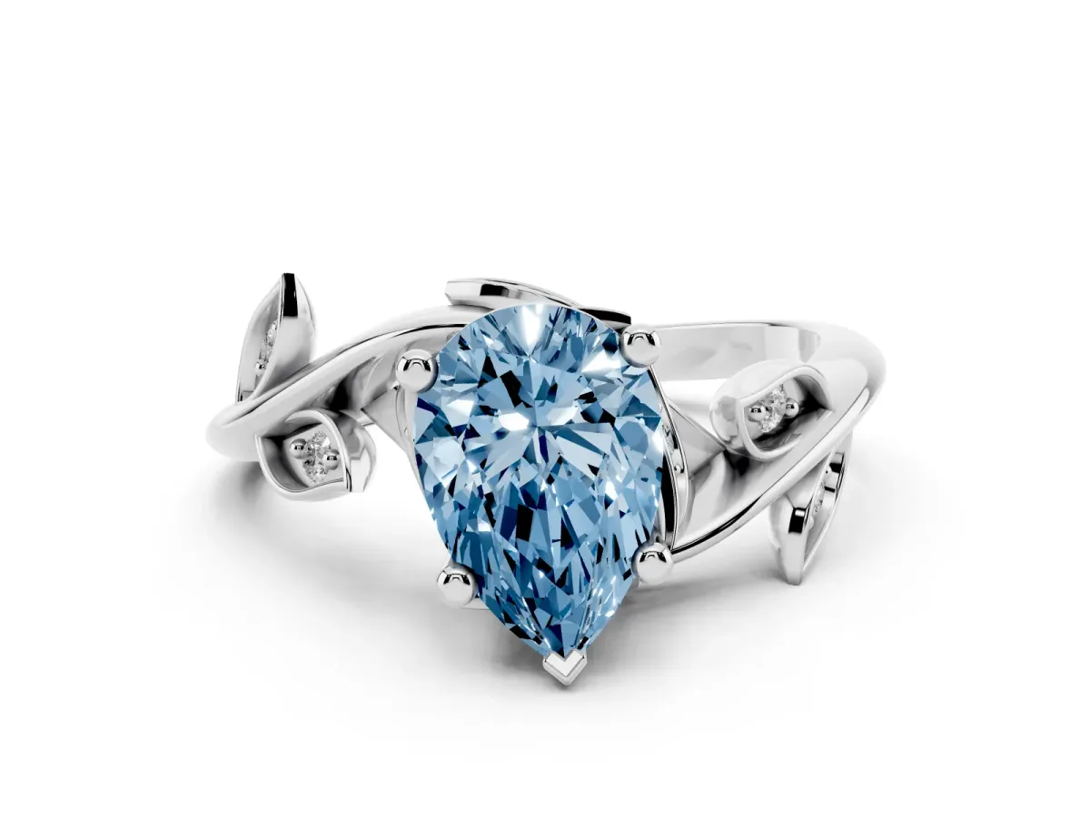 Fancy Blue Pear Cut Solitaire Twist Engagement Ring with Leaf Accents and Prong Setting Silver