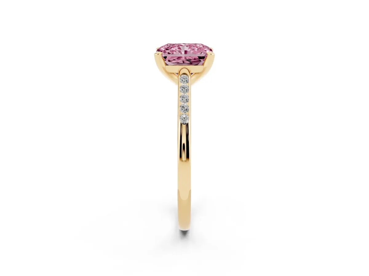 Fancy Pink Radiant Cut Diamond Solitaire Ring with Channel Set Round Band and Prong Setting Yellow gold