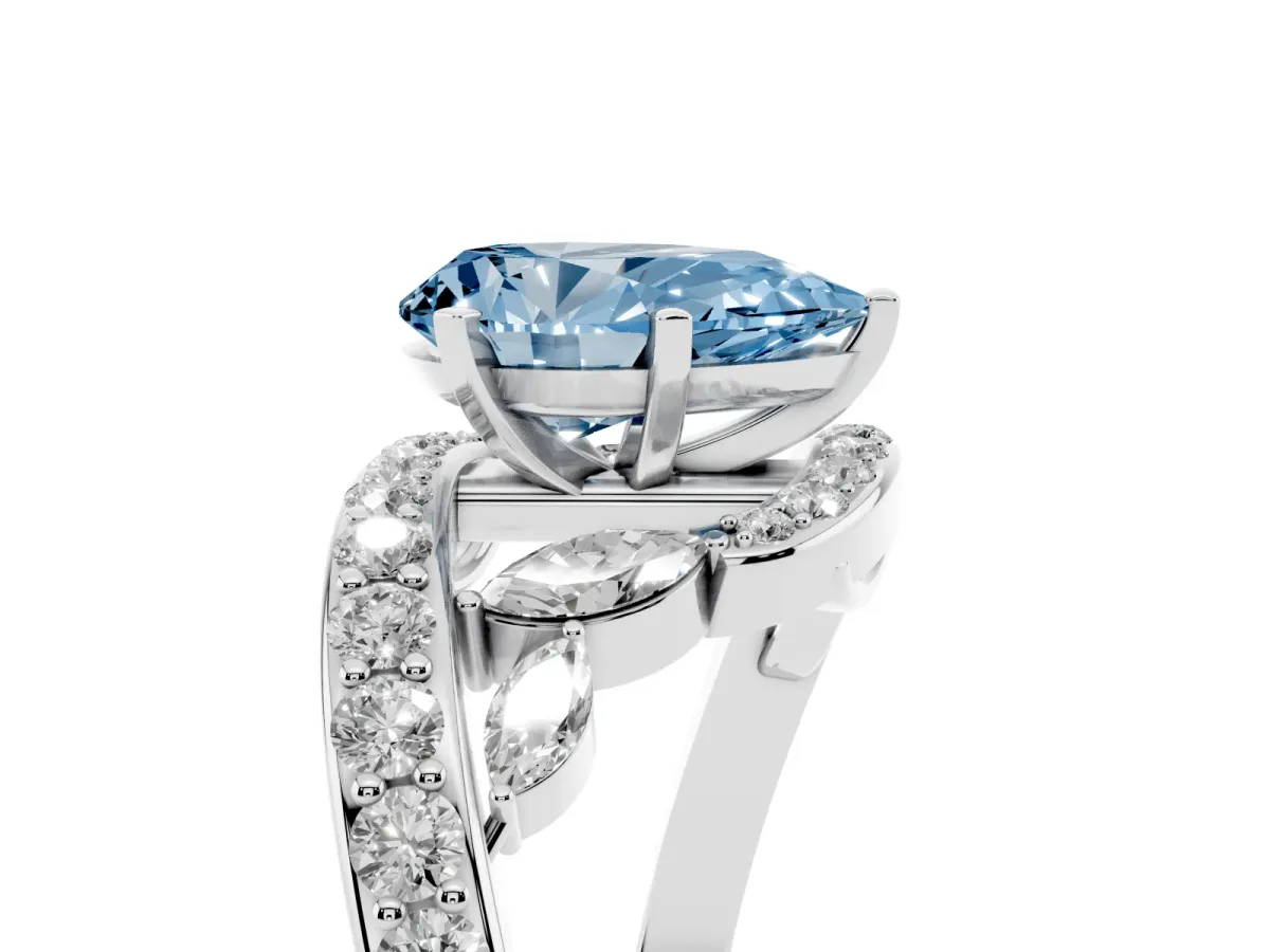 Fancy Blue Pear Cut Solitaire with Pavé Twist Band and Four-Prong Setting Silver