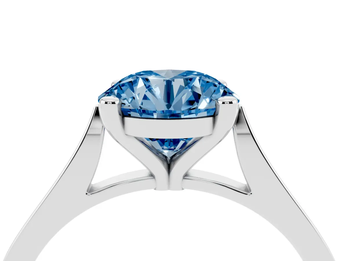 Fancy Blue Round Cut Solitaire Diamond Ring with Four-Prong Setting and Tapered Band Platinum