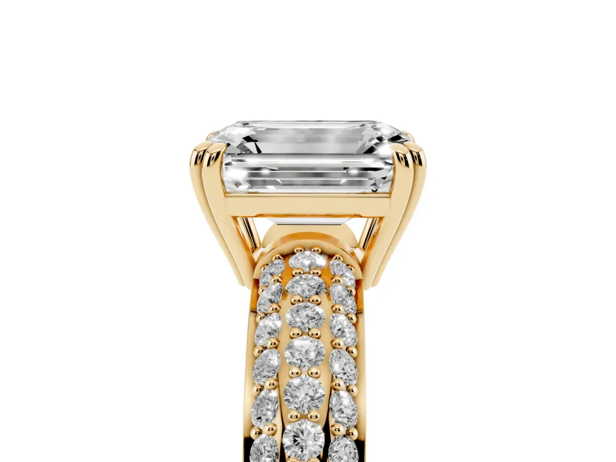 Emerald Cut Diamond Solitaire Ring with Multi-Row Round Pavé Band and Prong Setting Yellow gold