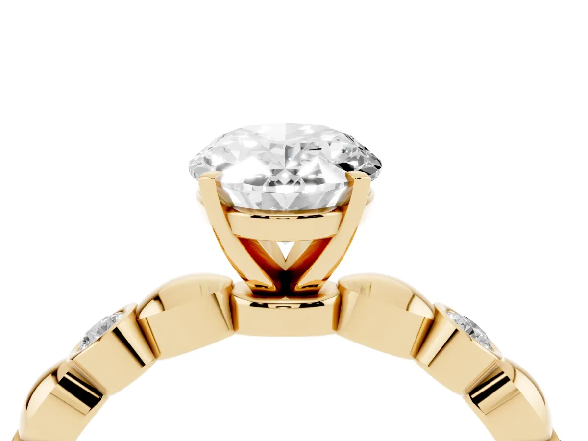 Oval Cut Solitaire Bezel-Set Diamond Ring with Beaded Band and Four-Prong Setting Yellow gold