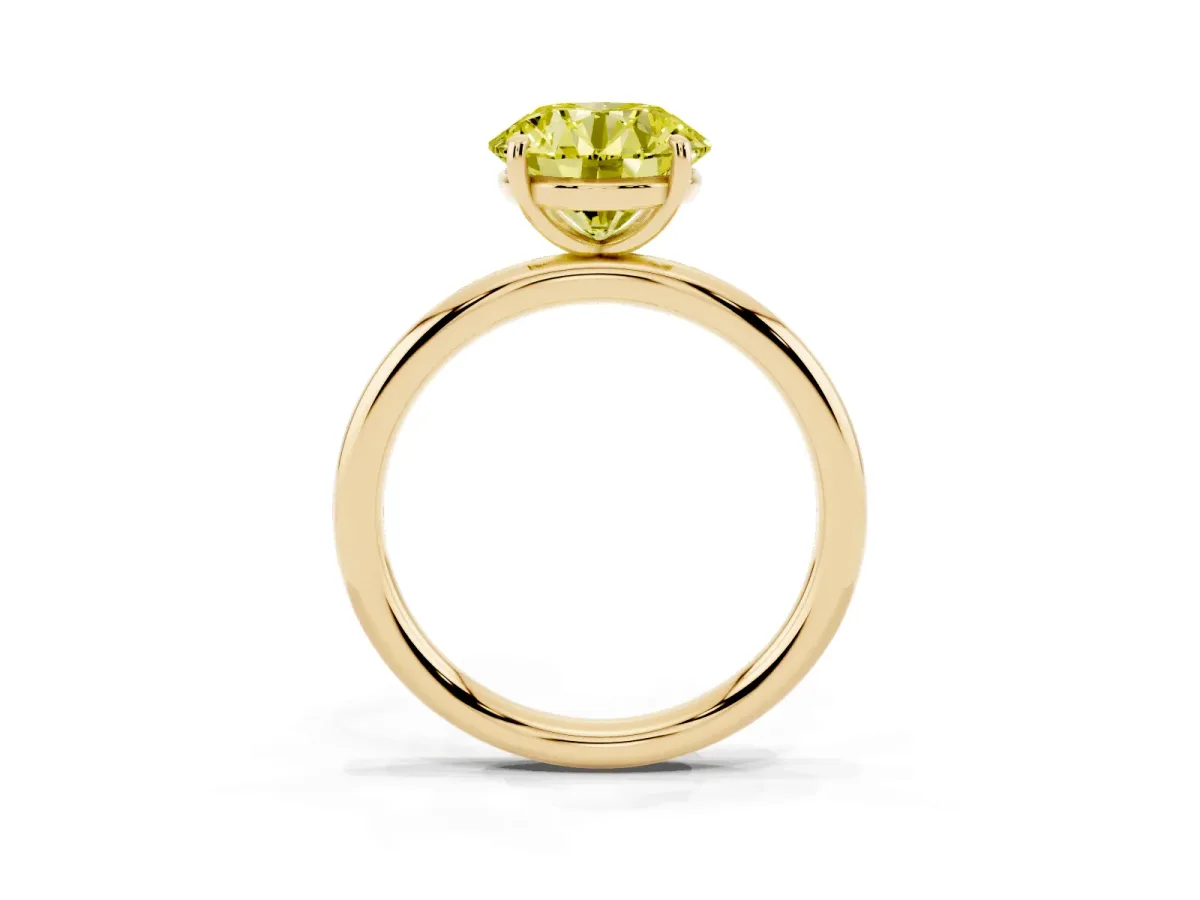 Fancy Yellow Round Cut Solitaire Diamond Ring with Four-Prong Setting on a Plain Band Yellow gold
