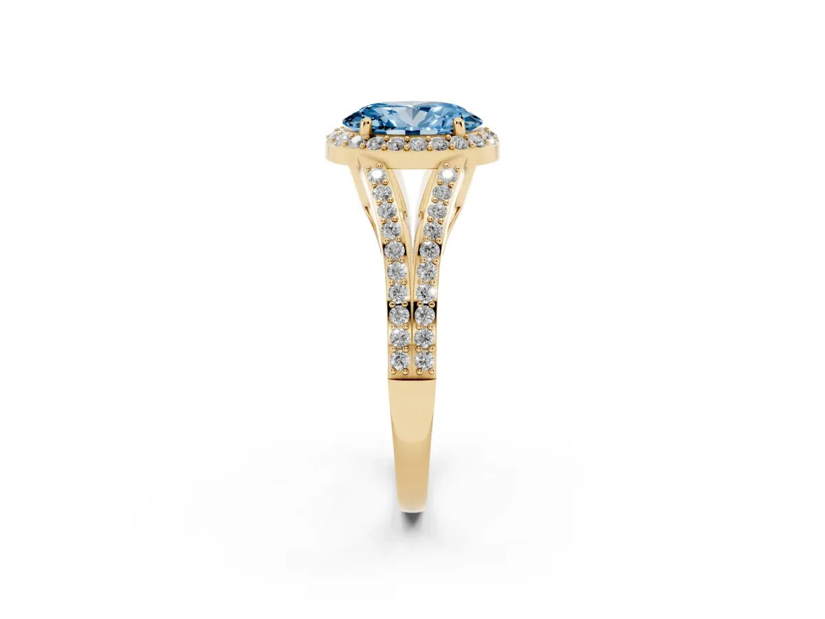 Fancy Blue Oval Cut Halo Split Shank Pave Diamond Ring with Four-Prong Setting Yellow gold