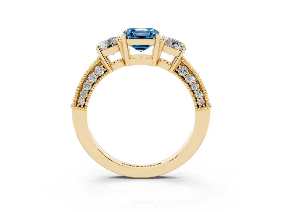 Fancy Blue Asscher Cut Three-Stone Diamond Ring with Pavé Band and Four-Prong Setting Yellow gold