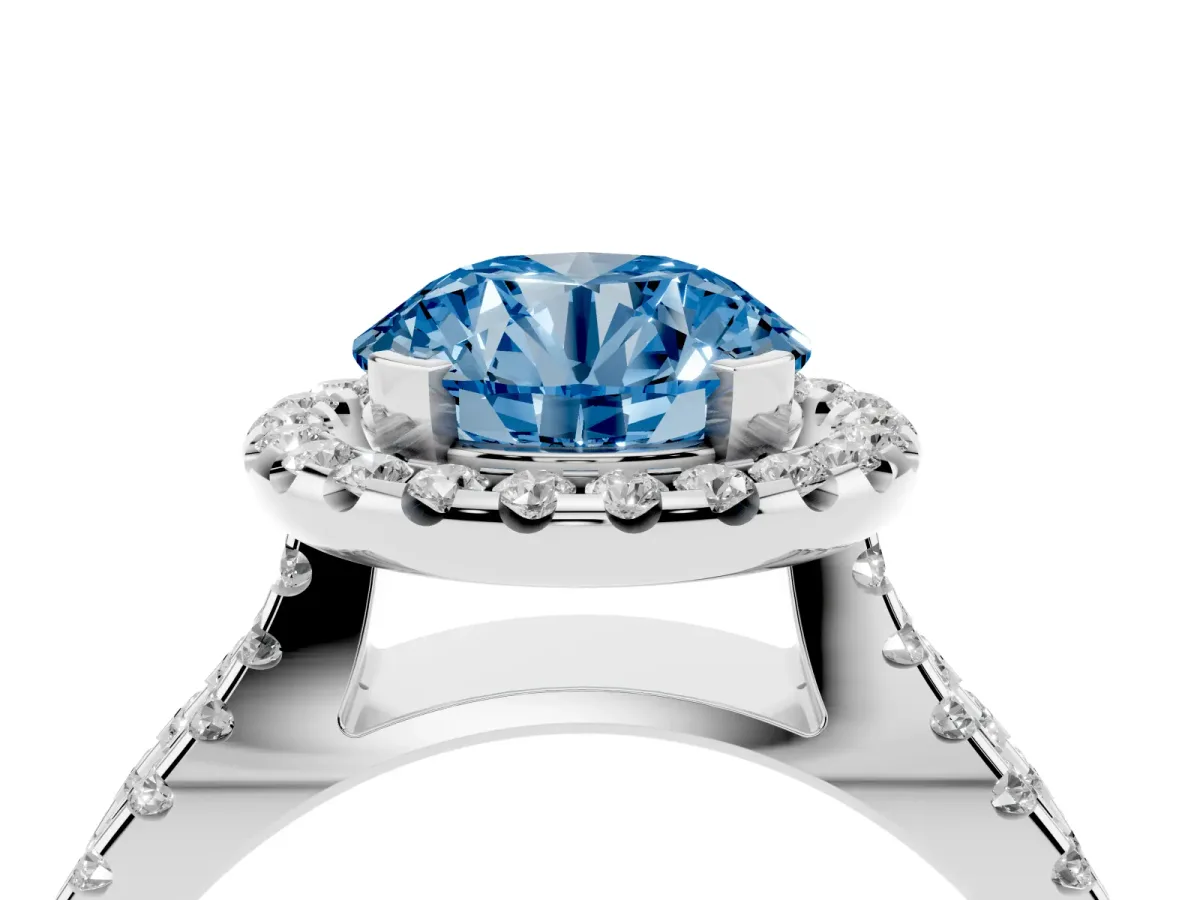 Fancy Blue Round Cut Diamond Halo Ring with Split Shank Pavé Band and Prong Setting Silver