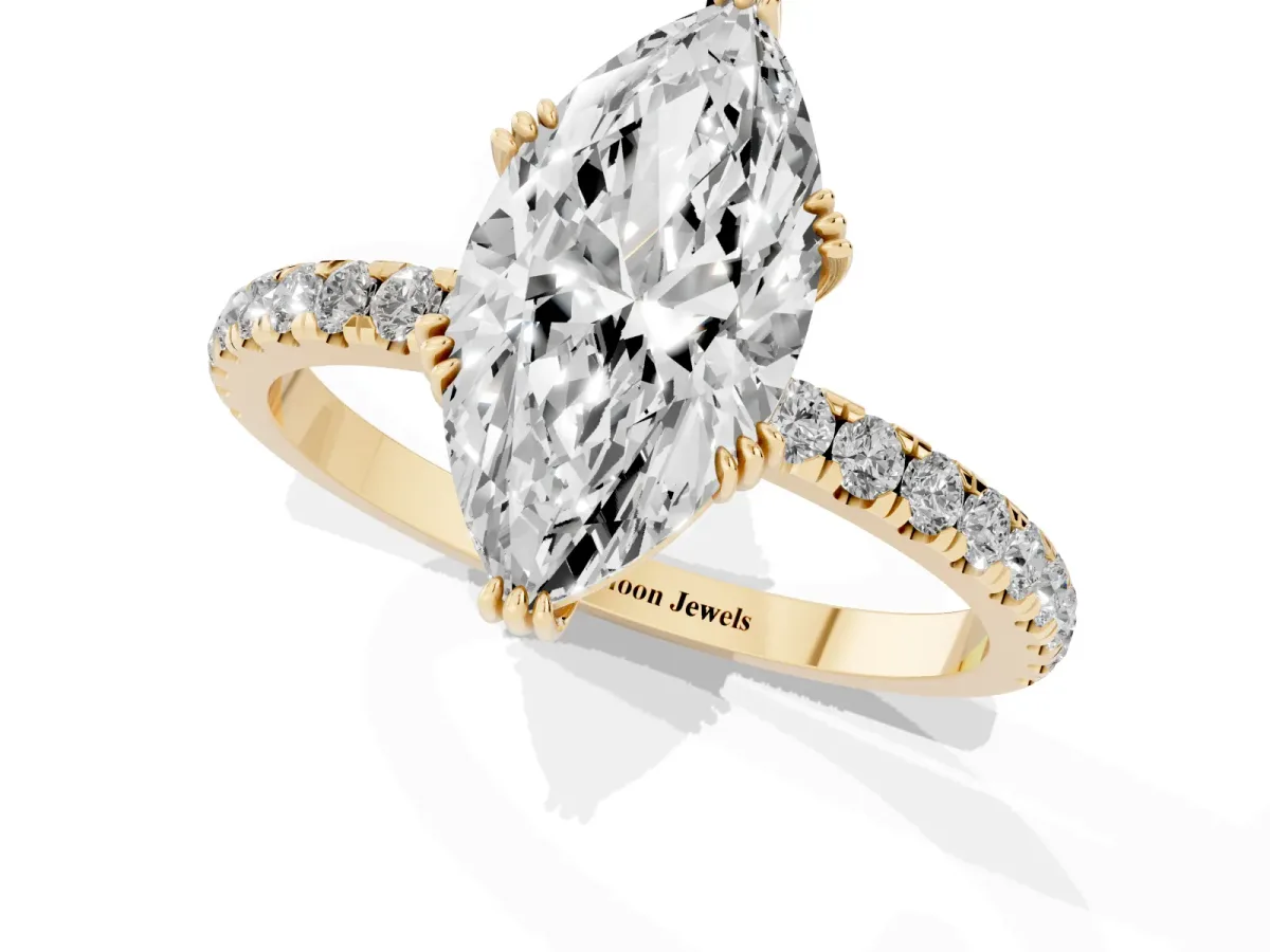 Marquise Cut Brilliant Solitaire with Pavé Band and Claw Prong Setting Yellow gold