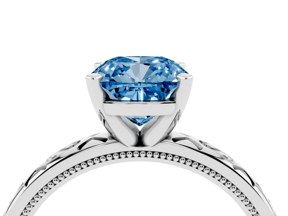 Fancy Blue Cushion Cut Solitaire Engagement Ring with Scrollwork Band and Four-Prong Setting Silver