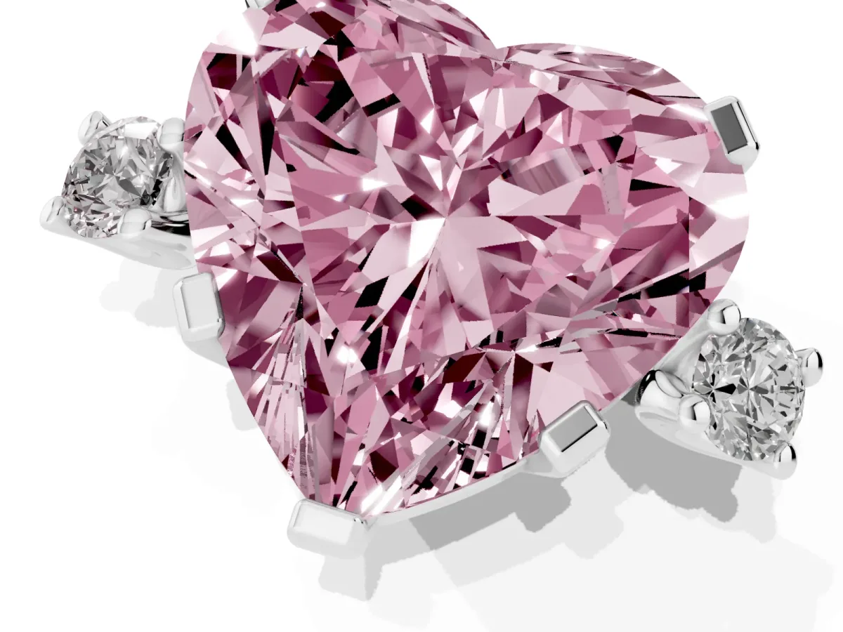Fancy Pink Heart Cut Cut Three-Stone Solitaire Ring with Round Accent Diamonds and Four-Prong Setting Silver