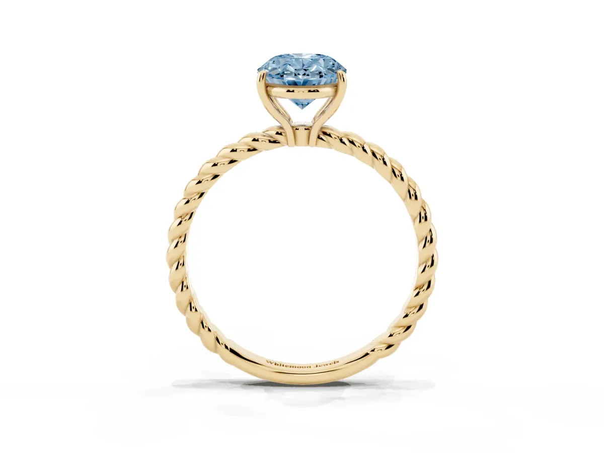 Fancy Blue Oval Cut Solitaire Twist Band Ring with Four-Prong Setting Yellow gold
