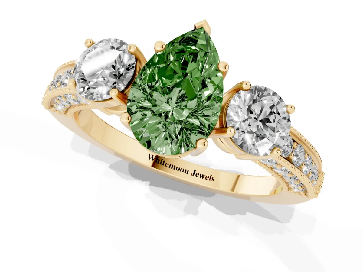 Fancy Green Pear Cut Three-Stone Diamond Ring with Pavé Band and Four-Prong Setting Yellow gold
