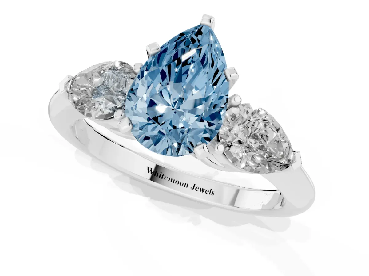 Fancy Blue Three-Stone Pear Cut Diamond Ring with Pear Side Stones and Four-Prong Setting Silver