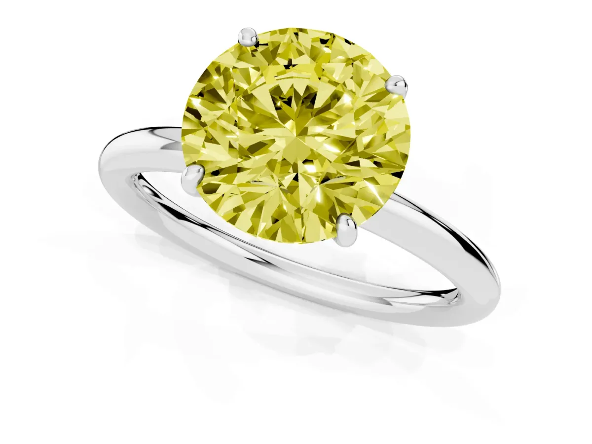 Fancy Yellow Round Cut Solitaire Diamond Ring with Four-Prong Setting on a Plain Band White gold