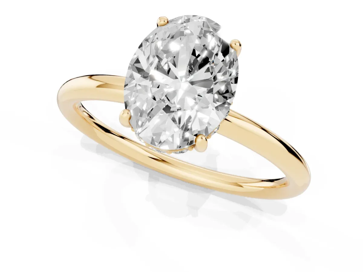 Oval Cut Solitaire Diamond Ring with a Classic Band and Four-Prong Setting Yellow gold
