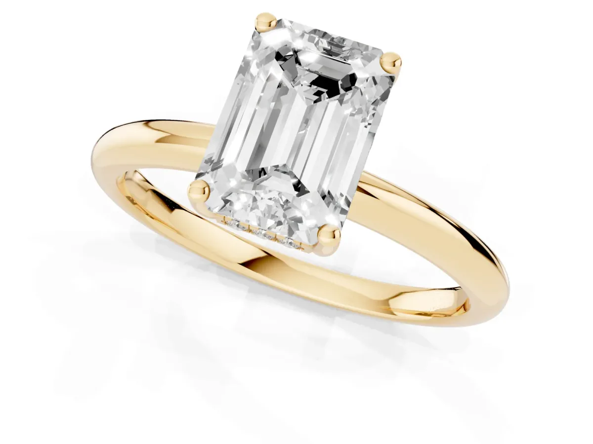 Emerald Cut Cut Solitaire Engagement Ring with Four-Prong Setting and Classic Band Yellow gold