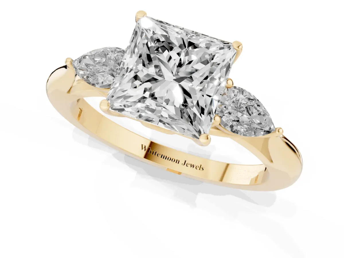 Three-Stone Princess Cut Diamond Ring with Pear Side Stones in Four-Prong Setting Yellow gold