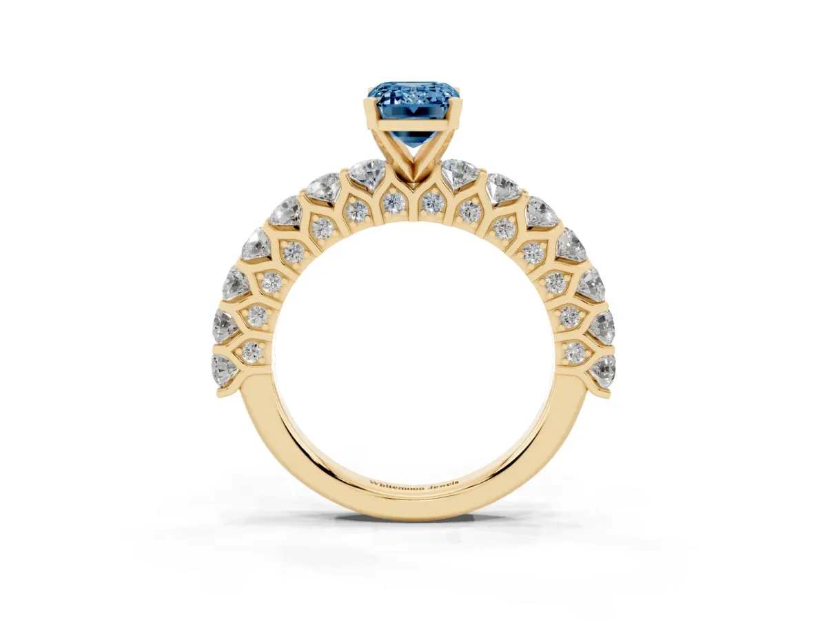 Fancy Blue Emerald Cut Diamond Solitaire Ring with Shared Prong Pavé Band and Four-Prong Setting Yellow gold