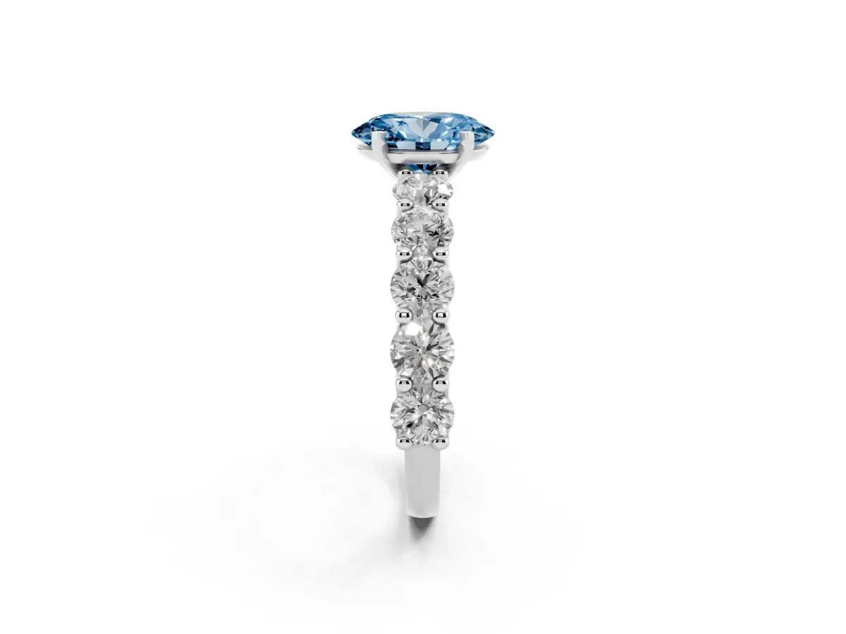 Fancy Blue Oval Cut Diamond Prong Setting with Side Stones on a Pave Band Silver
