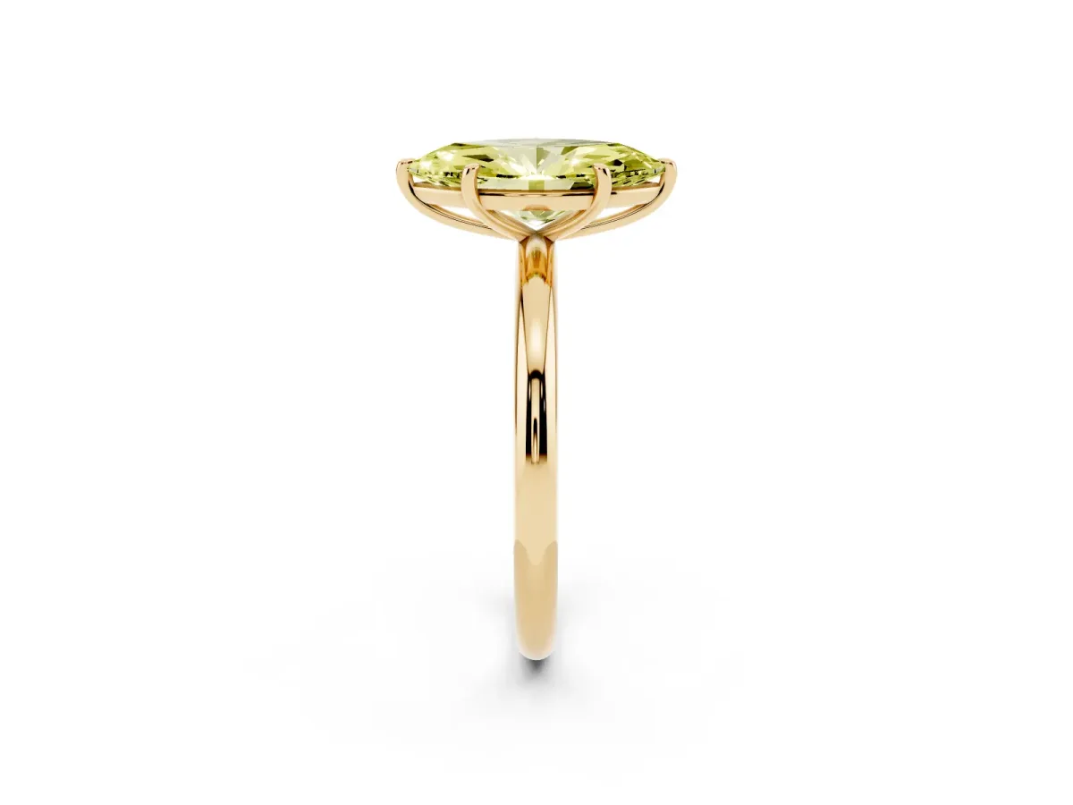 Fancy Yellow Oval Cut Solitaire Diamond Ring with Four-Prong Setting on a Plain Band Yellow gold