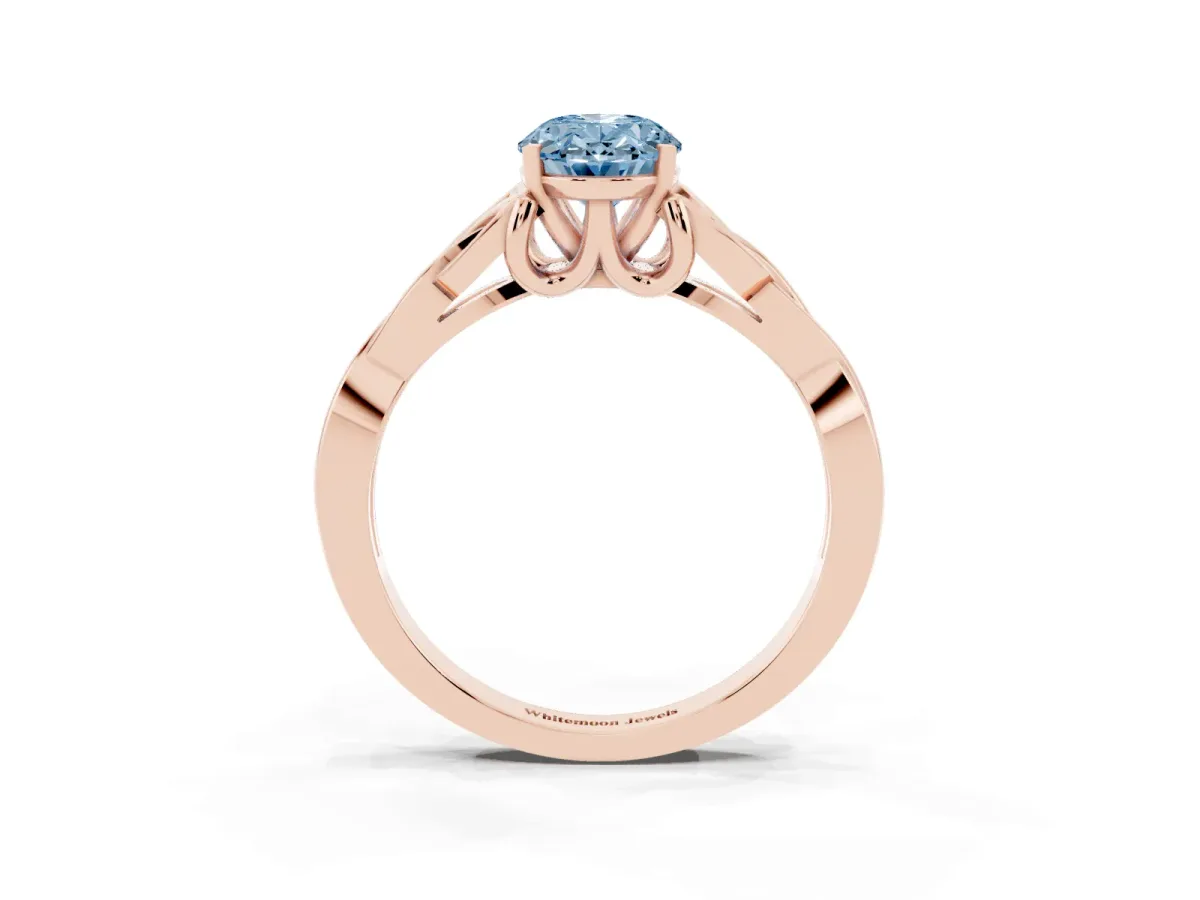 Fancy Blue Oval Cut Diamond Solitaire Engagement Ring with Celtic Knot Band and Four-Prong Setting Rose gold