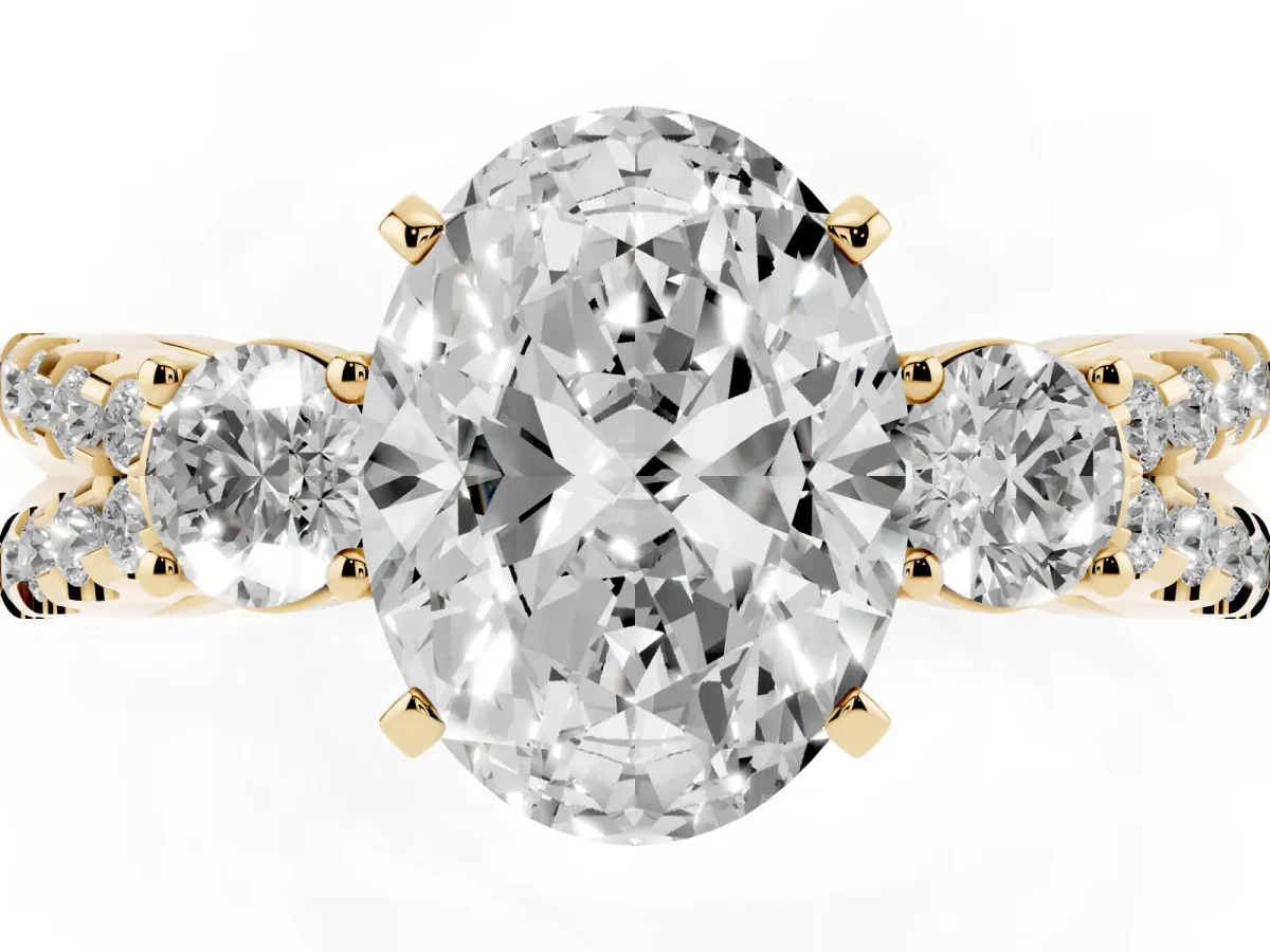 Oval Cut Diamond Three-Stone Ring with Pavé Split Shank and Four-Prong Setting Yellow gold