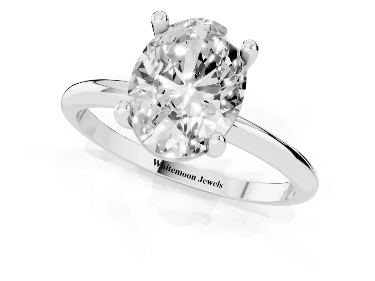 Oval Cut Solitaire Diamond Ring with 4-Prong Setting on a Classic Band Silver