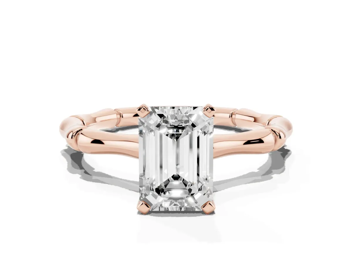 Emerald Cut Solitaire Diamond Ring with Bamboo Band and Four-Prong Setting Rose gold