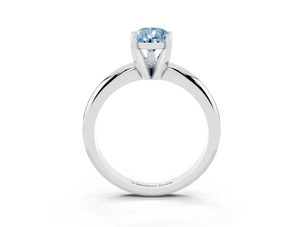 Fancy Blue Pear Cut Diamond Solitaire Engagement Ring with Round Band and Four-Prong Setting Silver