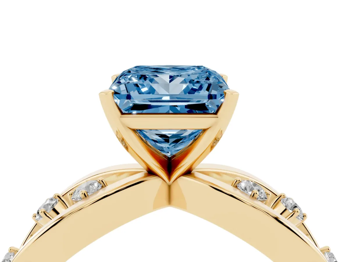 Fancy Blue Princess Cut Cut Solitaire Diamond with Side Stones on Criss-Cross Band and Four-Prong Setting Yellow gold