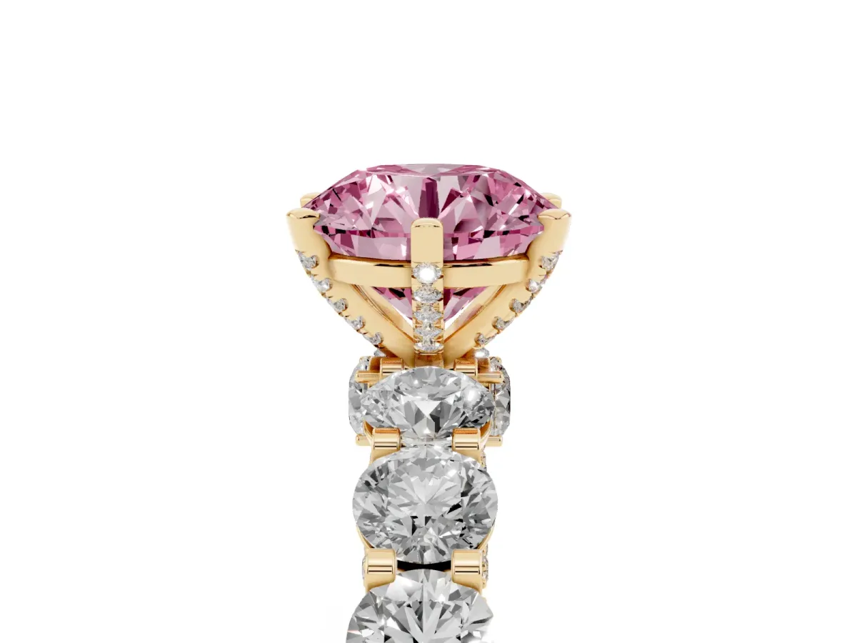 Fancy Pink Round Cut Diamond Side Stone Engagement Ring with Four-Prong Setting Yellow gold