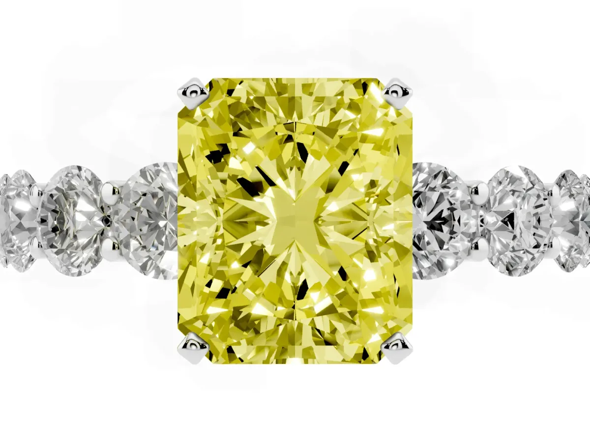 Fancy Yellow Radiant Cut Diamond Prong Setting with Side Stones on a Pave Band Silver