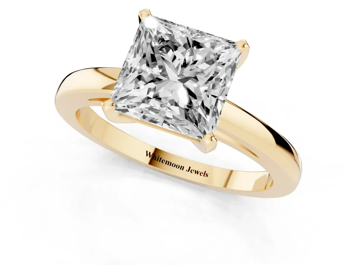 Princess Cut Solitaire Diamond Engagement Ring with Four-Prong Setting on a Classic Band Yellow gold
