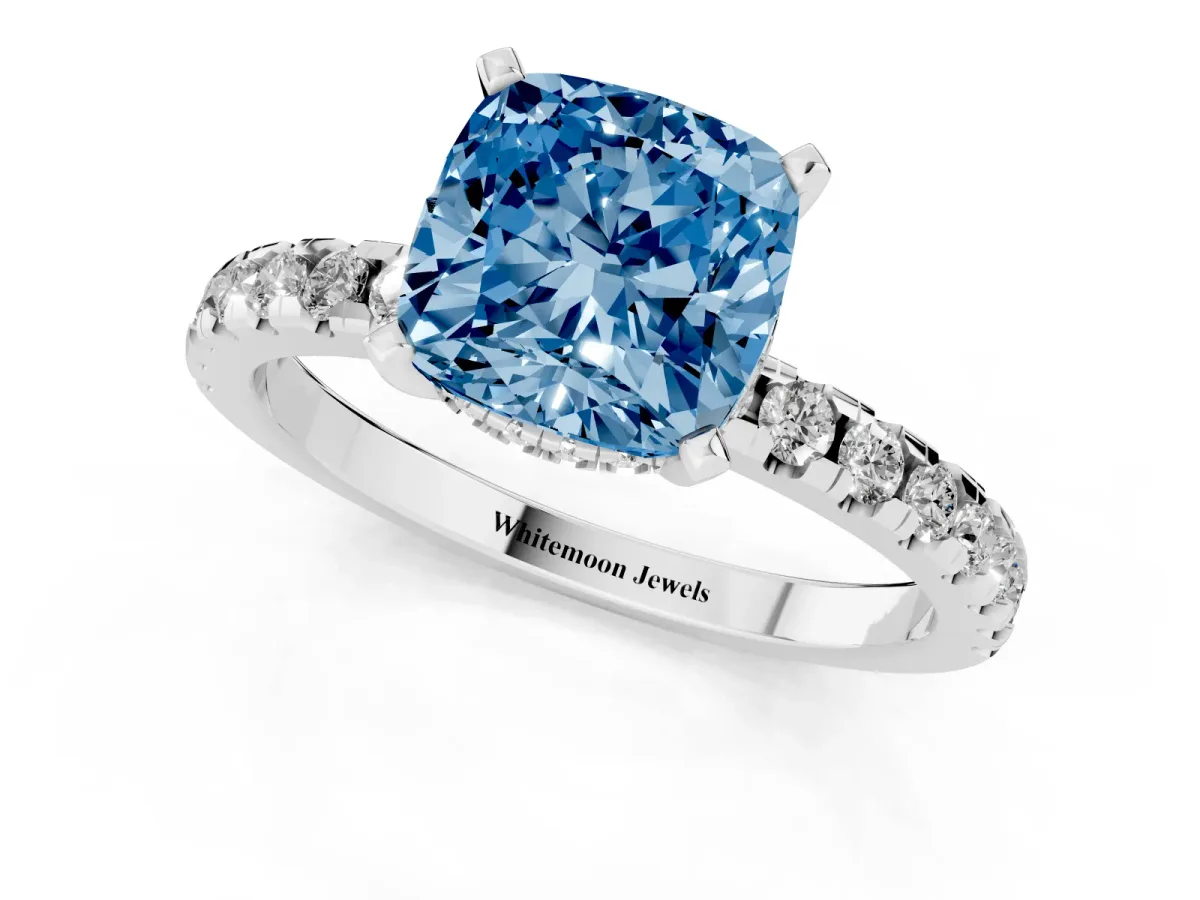 Fancy Blue Cushion Cut Diamond Solitaire Ring with Round Pavé Band and Four-Prong Setting Silver