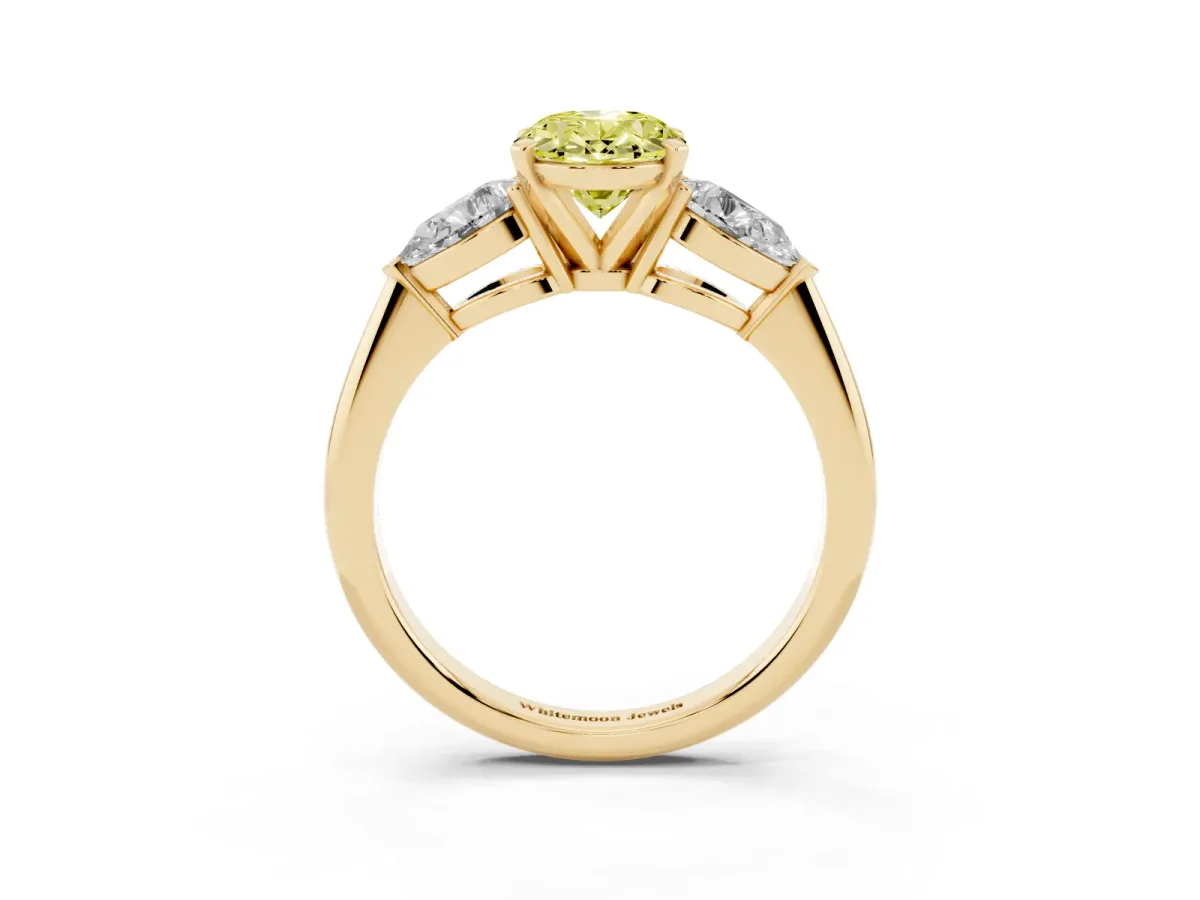 Fancy Yellow Three-Stone Oval Cut Diamond Ring with Pear Side Stones and Four-Prong Setting Yellow gold