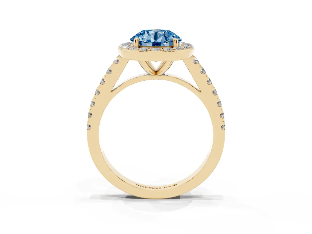 Fancy Blue Round Cut Diamond Halo Ring with Round Pavé Split Shank and Prong Setting Yellow gold