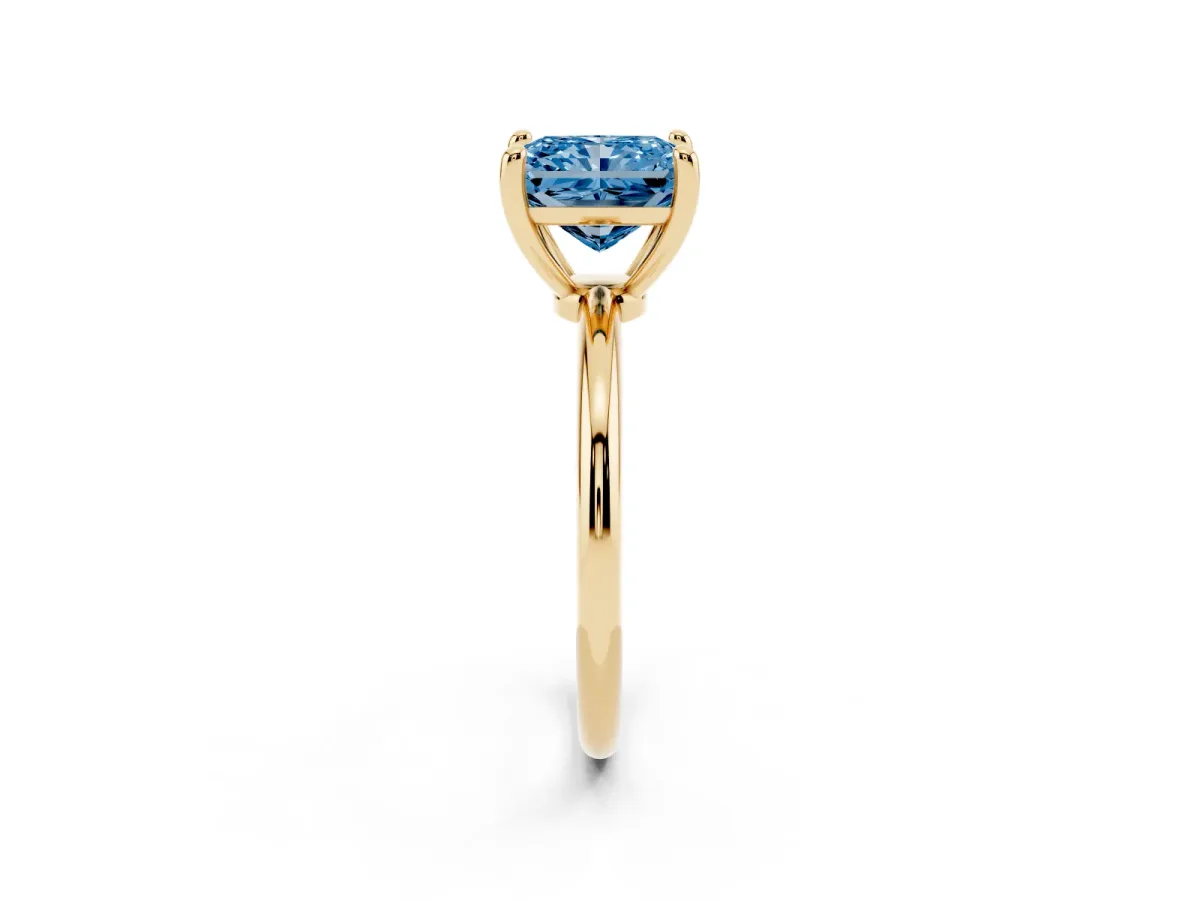 Fancy Blue Radiant Cut Solitaire Diamond Ring with 4-Prong Setting on a Classic Band Yellow gold
