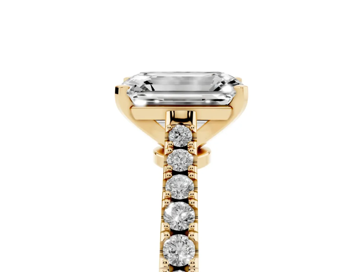 Emerald Cut Cut Solitaire Diamond Engagement Ring with Pave Band and Four-Prong Setting Yellow gold