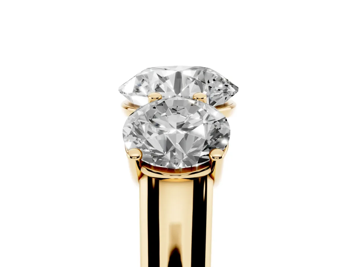 Round Cut Three-Stone Diamond Ring with Prong Setting on a Classic Band Yellow gold