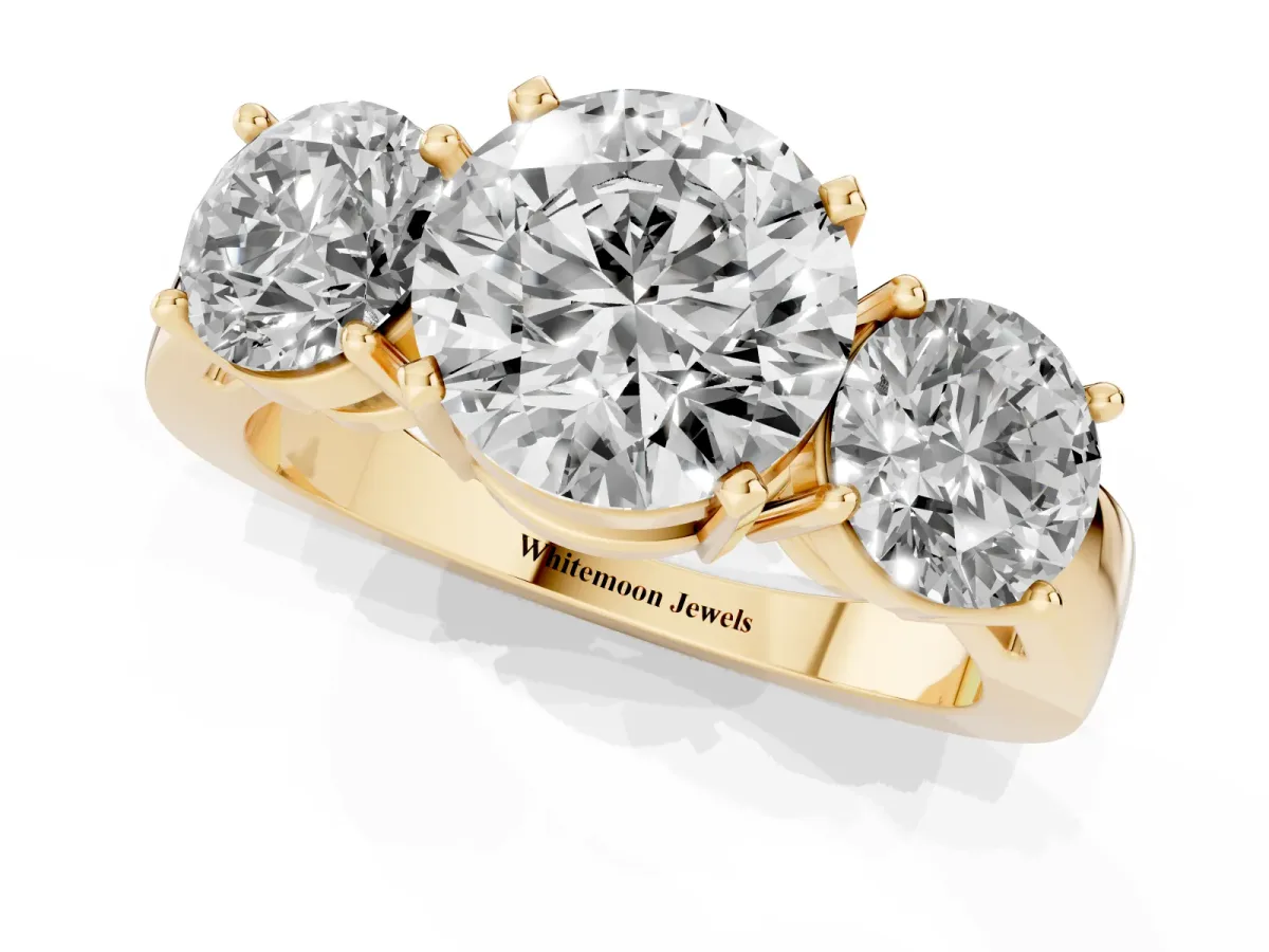 Three-Stone Round Cut Diamond Ring with Round Side Stones, Classic Band, and Four-Prong Setting Yellow gold