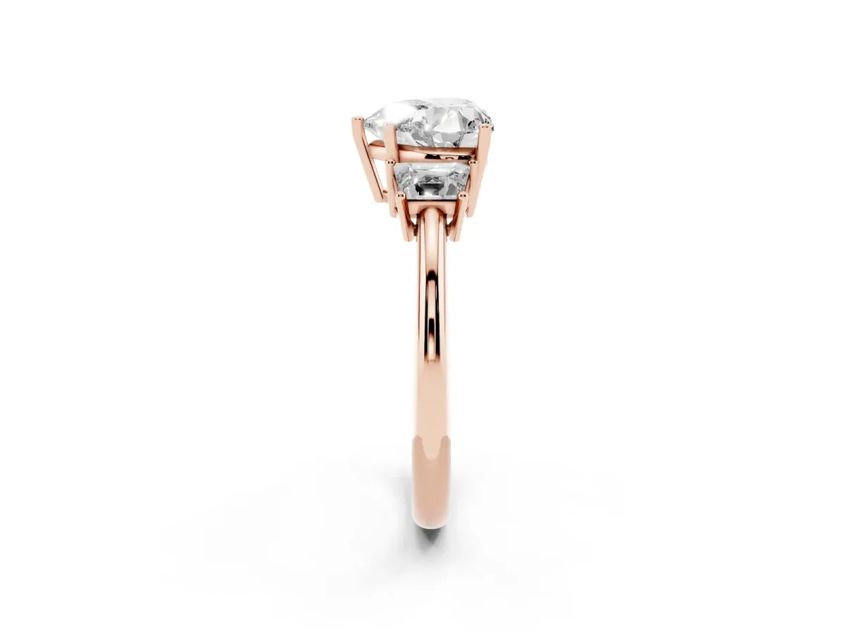 Heart Cut Diamond Three-Stone Ring with Trapezoid Side Stones and Prong Setting Rose gold