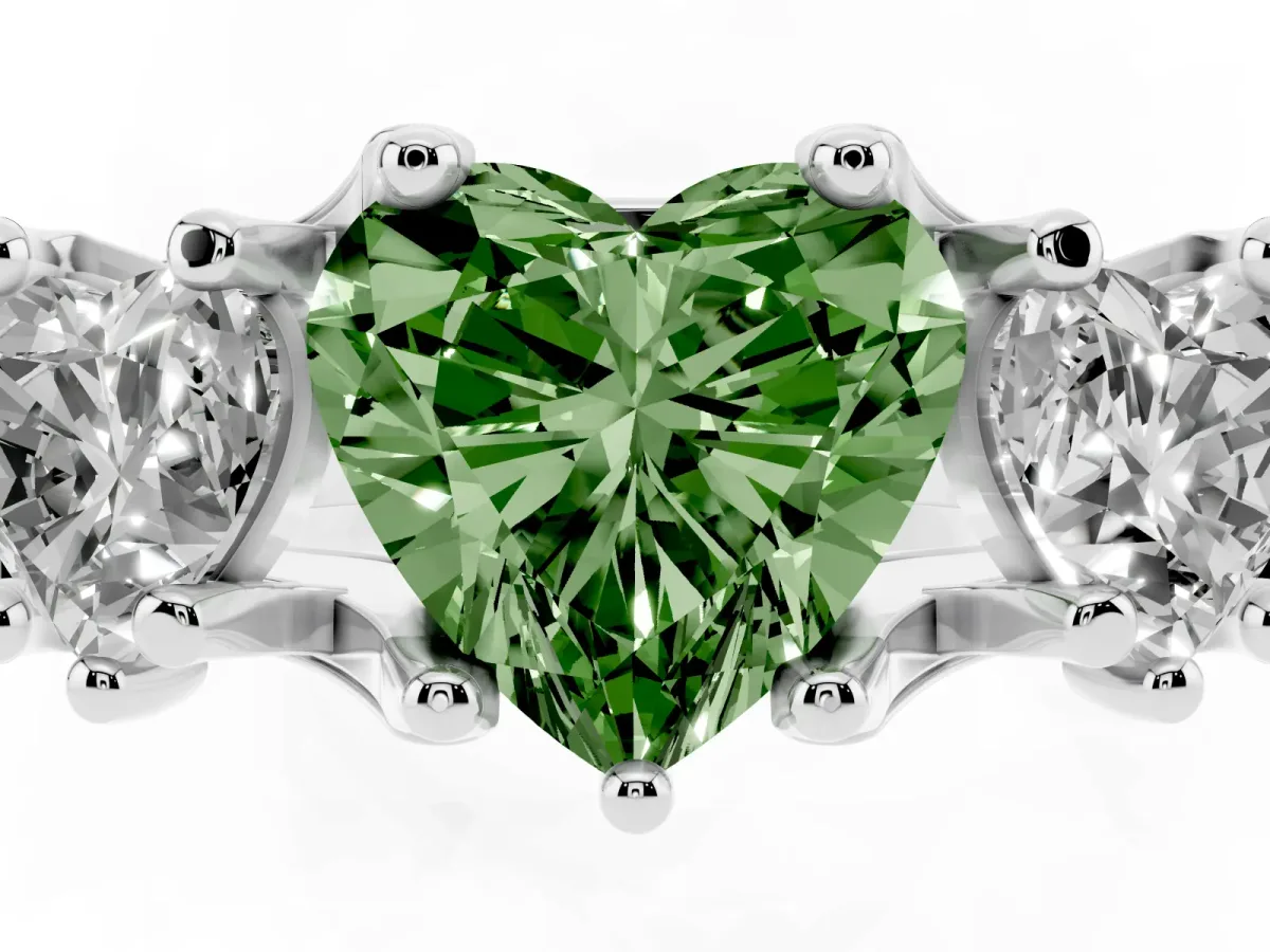 Fancy Green Heart Cut Diamond Three-Stone Ring with Channel Set Band and Four-Prong Setting Silver