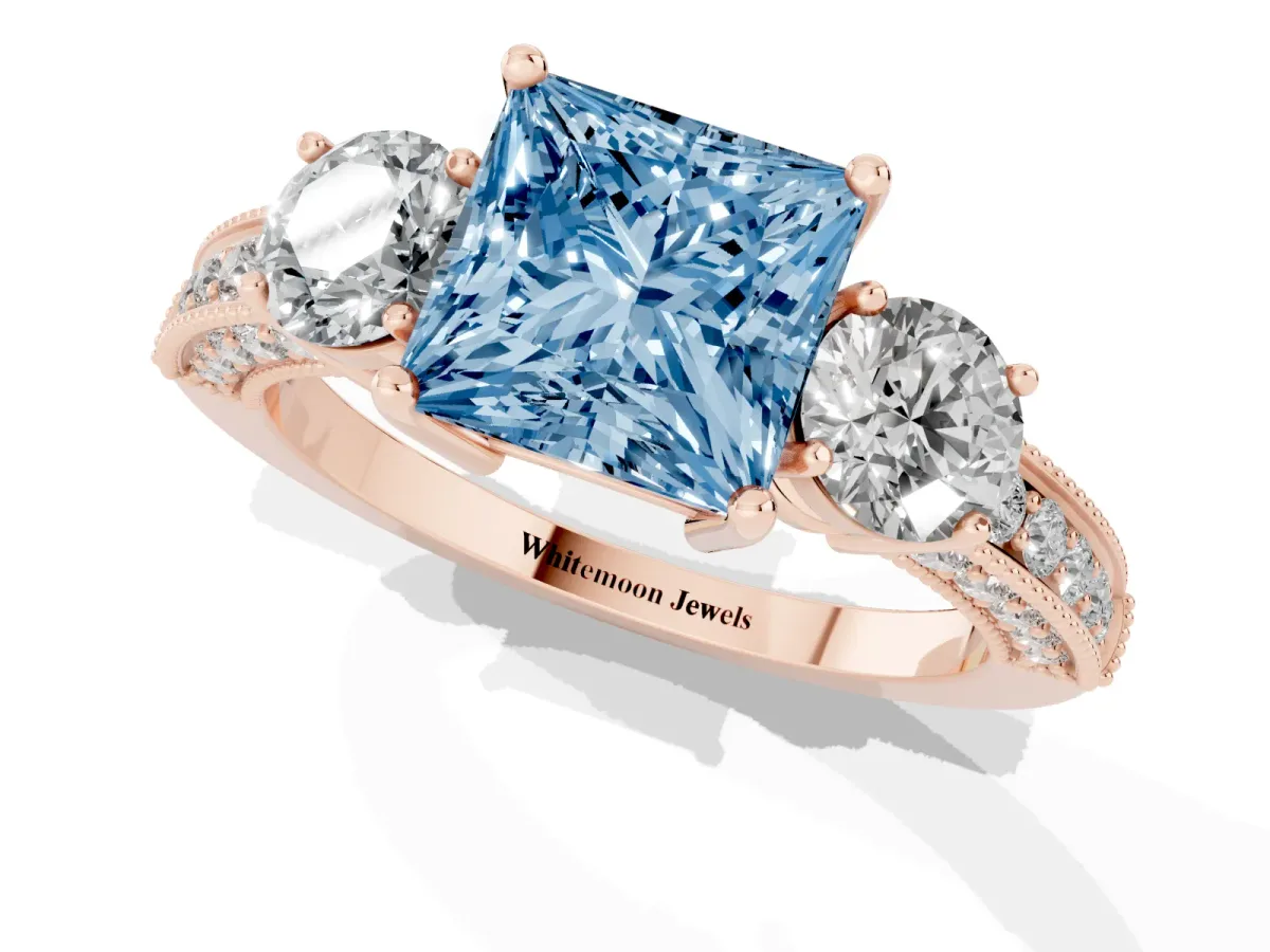 Fancy Blue Princess Cut Three-Stone Diamond Ring with Pavé Band and Four-Prong Setting Rose gold